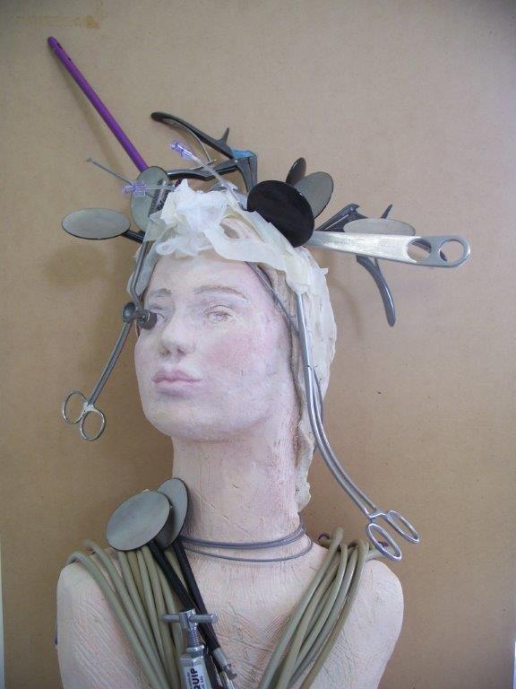 General nurse sculpture with surgical instruments in hair