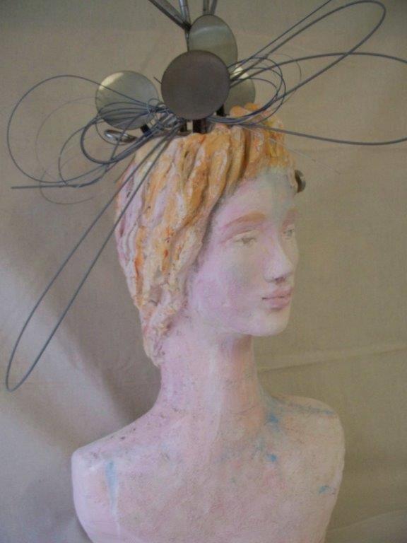 Cardiac Nurse Sculpture with surgical instruments in hair